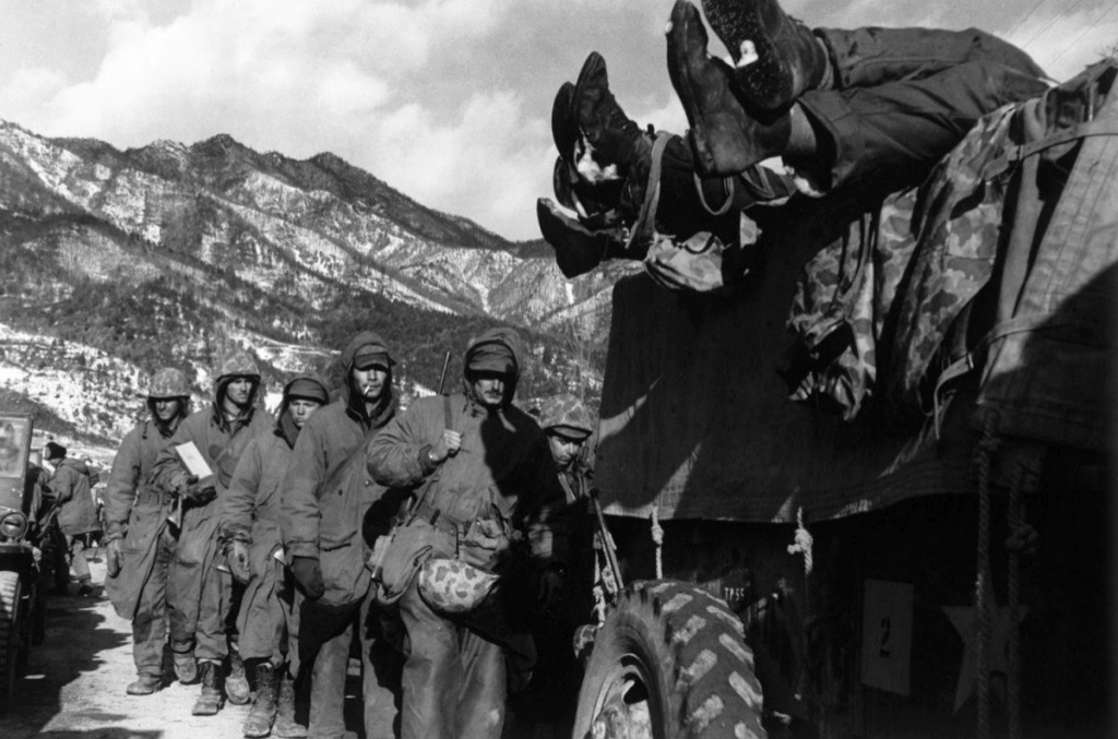 David Douglas Duncan - Marines File Past a Truck Load with Dead Troops during Retreat from Chosin Reservoir David Douglas Duncan - Marines File Past a Truck Load with Dead Troops during Retreat from Chosin Reservoir