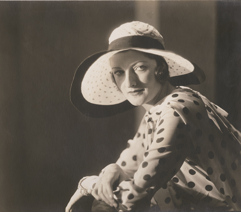 Woman in Polka Dot Shirt and Hat