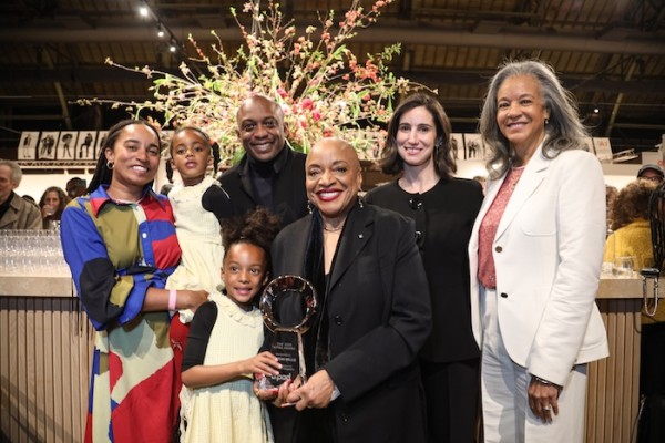 The 2026 AIPAD Award was presented during the Opening Evening by former board member Arnika Dawkins and AIPAD Executive Director Lydia Melamed Johnson to Dr. Deborah Willis. Dr. Willis, joined by her family, accepted the honor. (Photo by Erica Price. Courtesy of AIPAD.) The 2026 AIPAD Award was presented during the Opening Evening by former board member Arnika Dawkins and AIPAD Executive Director Lydia Melamed Johnson to Dr. Deborah Willis. Dr. Willis, joined by her family, accepted the honor. (Photo by Erica Price. Courtesy of AIPAD.)