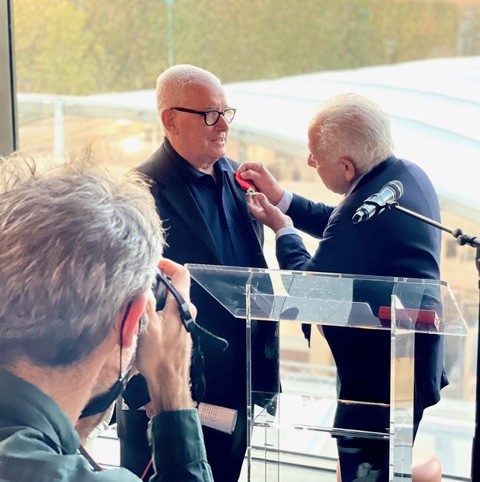 Alain Paviot receiving his French Legion of Honor metal during Paris Photo in 2021.